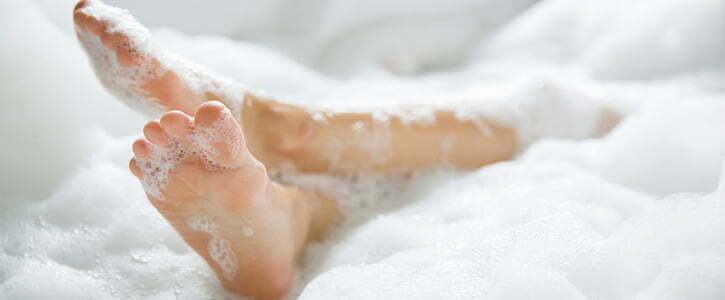 legs in bath of bubbles